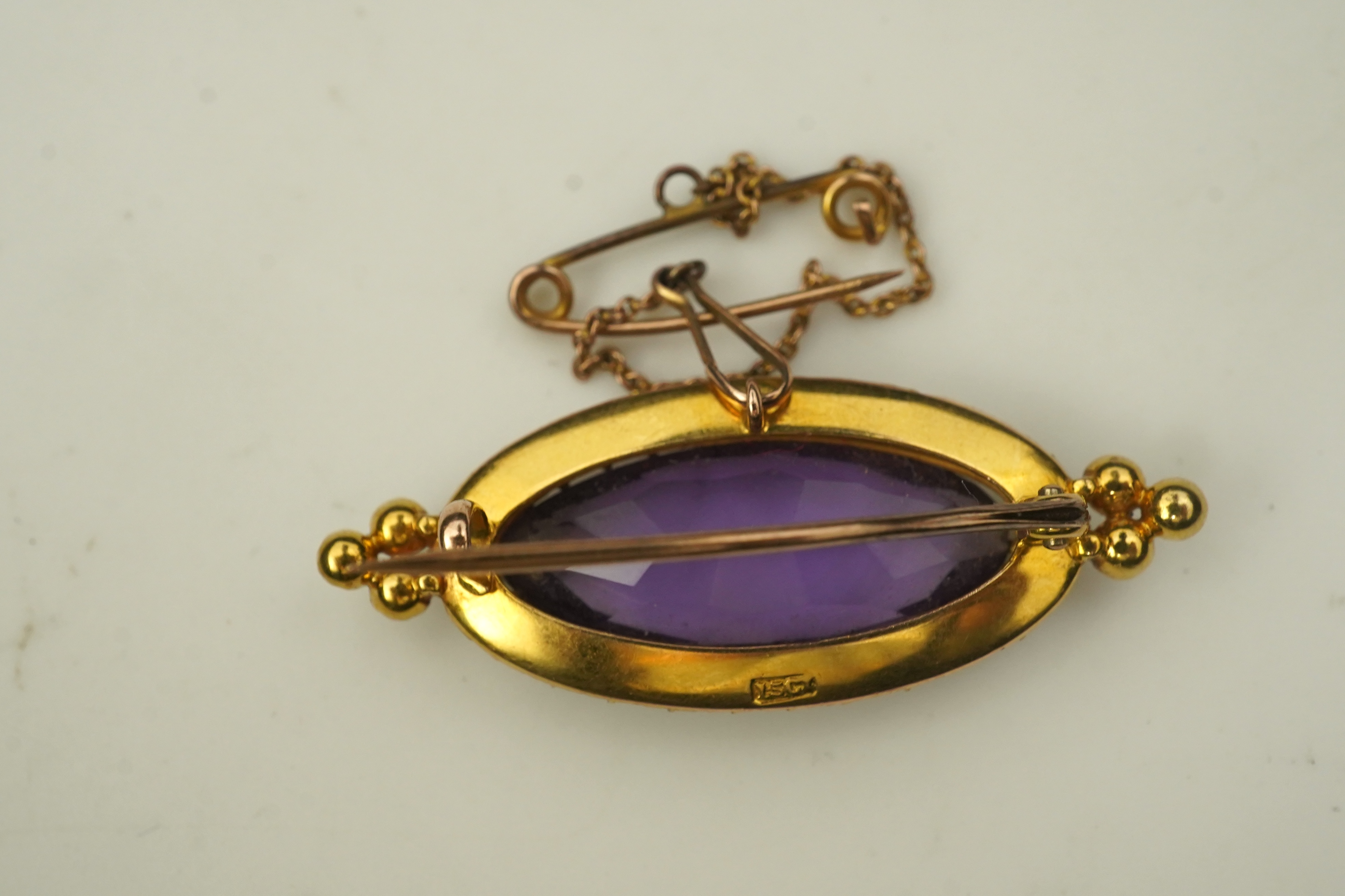 An amethyst and pearl brooch, circa 1900